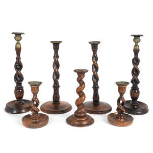 Appraisal: A Group of Seven English Barley-Twist Oak Candlesticks TH TH