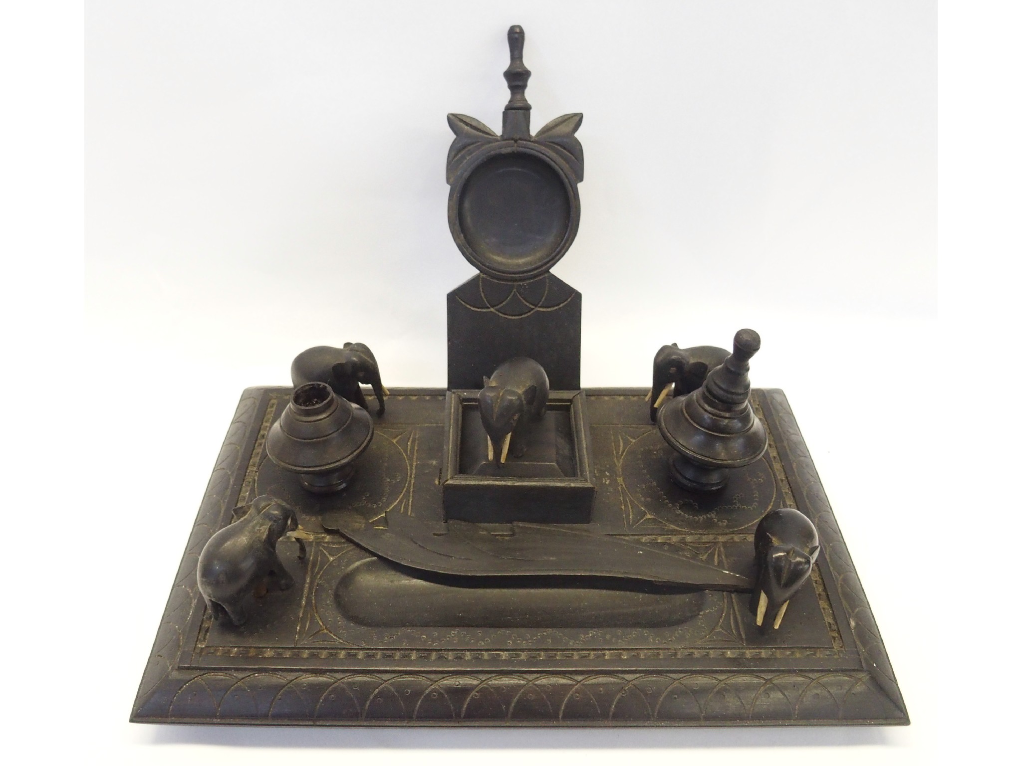 Appraisal: Indian carved ebonised wood inkstand