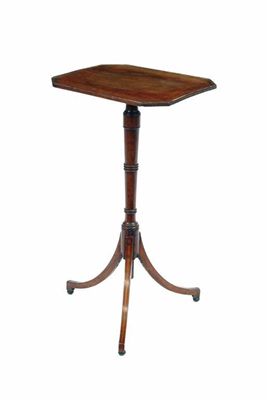 Appraisal: A mahogany tripod table inlaid stringing the reeded edge top