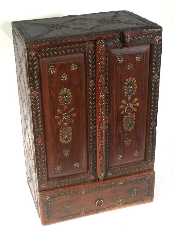 Appraisal: Large folk art carved cabinet with raised floral designs to