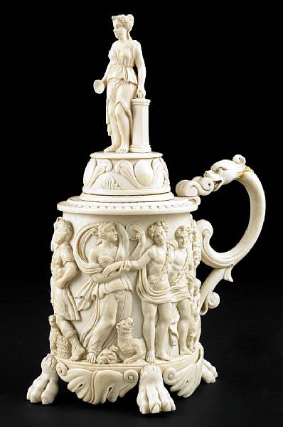 Appraisal: A Continental carved ivory tankard th century The hinged lid