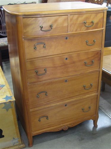 Appraisal: MAPLE TALL CHEST OF DRAWERS American c the front featuring