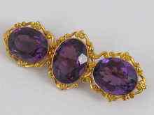 Appraisal: An exquisite three stone amethyst and yellow metal tests carat