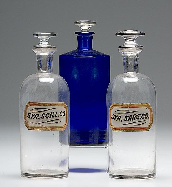 Appraisal: PAIR OF LABEL UNDER GLASS PHARMACY BOTTLES with Cobalt Pharmacy