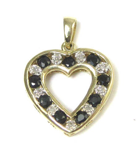 Appraisal: BLACK SAPPHIRE AND DIAMOND PENDANT The k yellow gold open