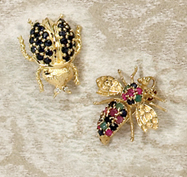 Appraisal: GEMSTONE BROOCHES k yellow gold in wasp design set with