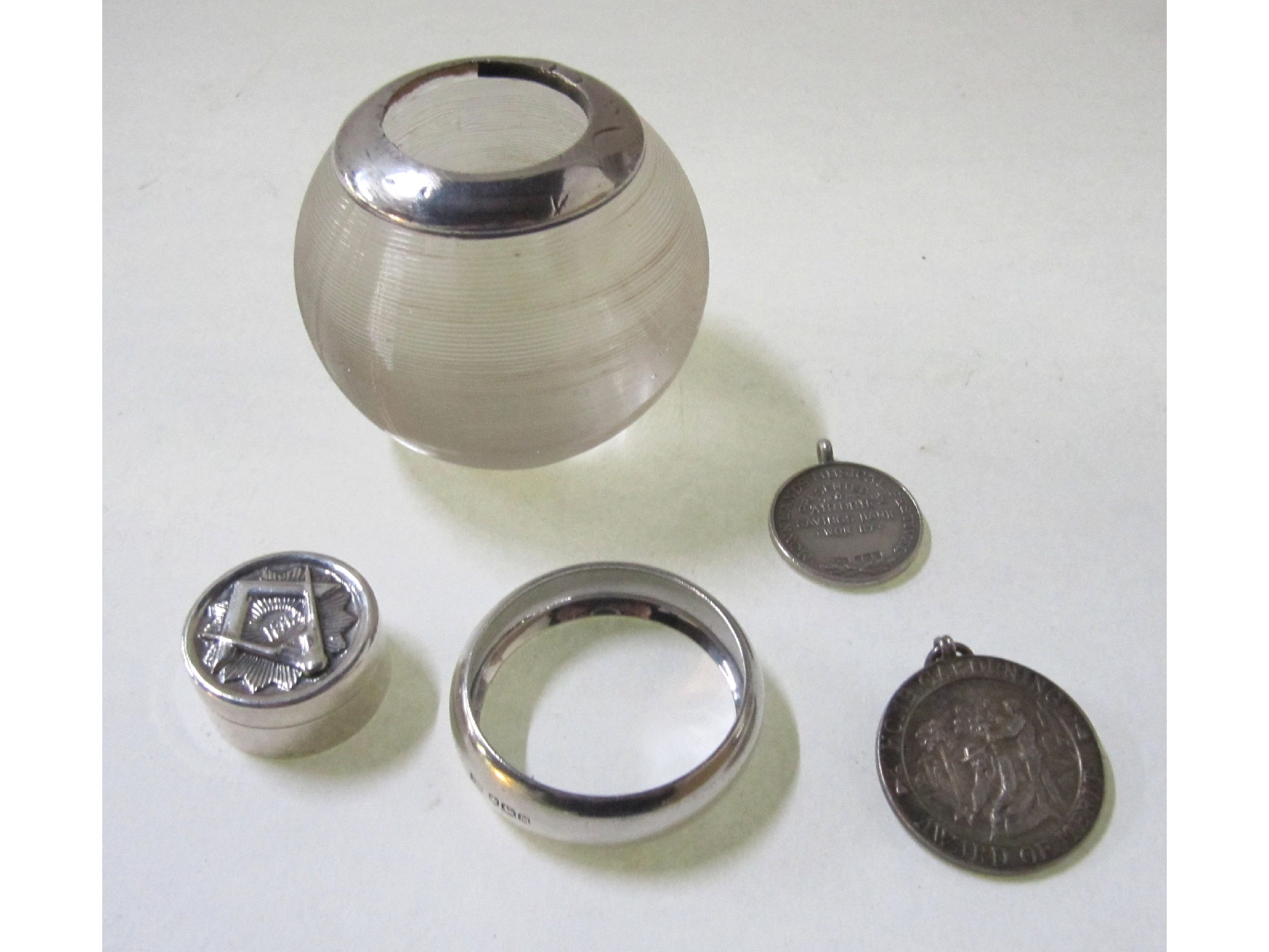 Appraisal: A lot comprising a silver mounted match holder striker a