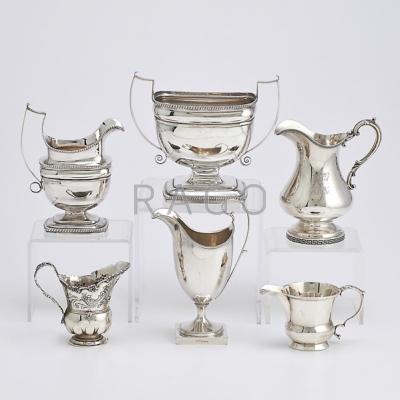 Appraisal: AMERICAN SILVER HOLLOWARE Six pieces urn-shaped coin silver cream pitcher