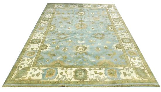 Appraisal: RUG Oushak light blue field ensconced in a wide cream