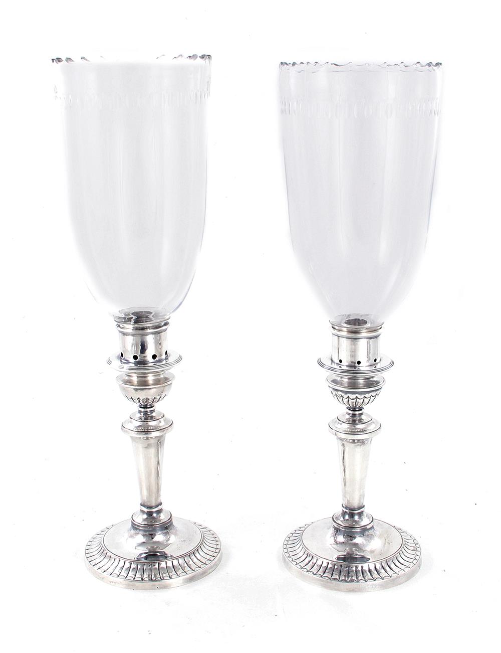 Appraisal: Pair English silverplate candlesticks with hurricane shades early th century