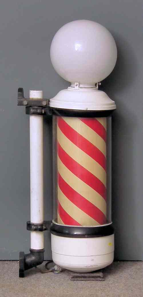 Appraisal: A s enamelled metal cased barber's pole with fitted globe