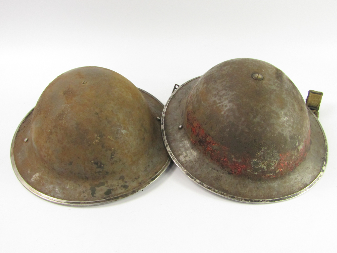 Appraisal: Two British army helmets possibly WWI issue