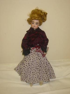 Appraisal: An F G bisque head fashion doll with fixed blue