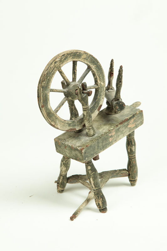 Appraisal: TOY SPINNING WHEEL Early th century softwood Layered paint history