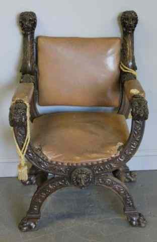 Appraisal: Carved and Upholstered Savonarola Chair With claw feet and lions