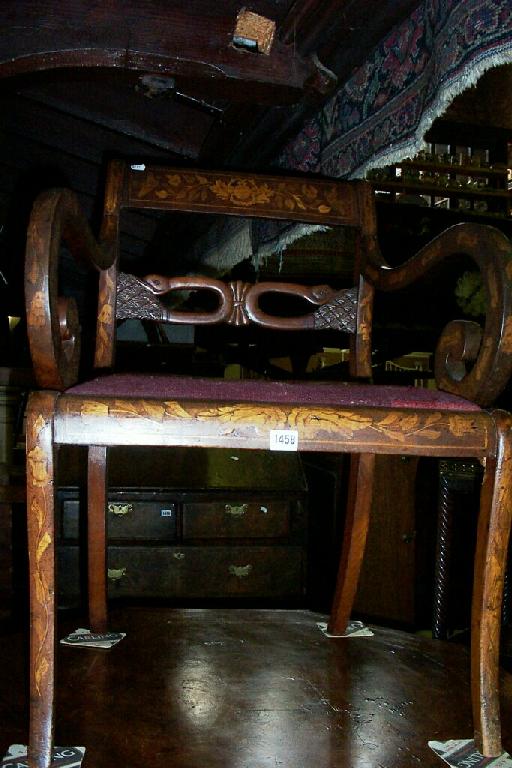 Appraisal: An early th century mahogany sabre legged elbow chair with