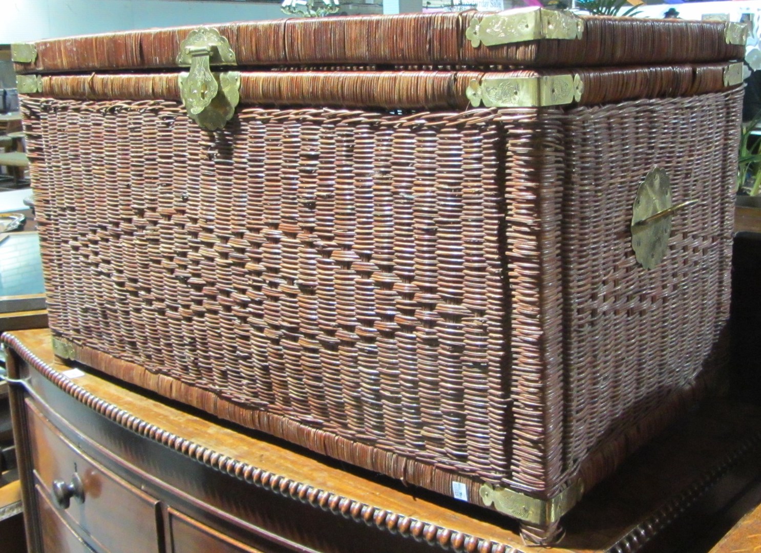 Appraisal: A th century Oriental brass bound wicker trunk