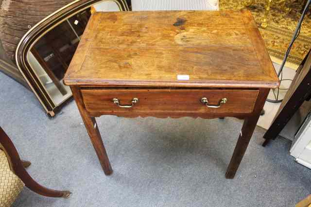 Appraisal: A GEORGE III MAHOGANY SIDE TABLE with moulded edge and