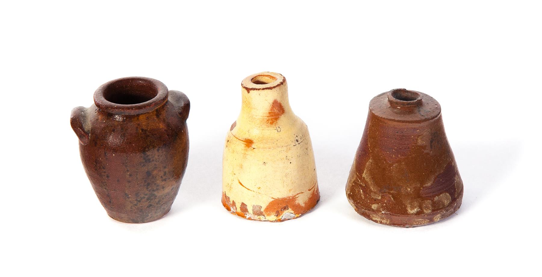 Appraisal: THREE PIECES OF AMERICAN REDWARE Mid th century Miniature urn