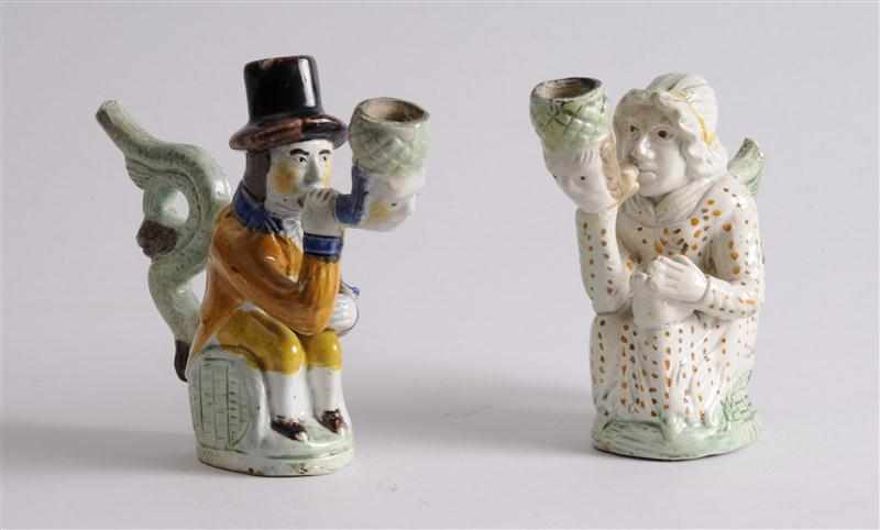 Appraisal: TWO ENGLISH PEARLWARE FIGURAL PIPES Modeled as a seated man