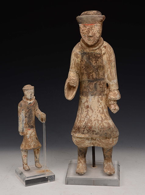 Appraisal: A CHINESE POTTERY TOMB FIGURE male subject with outstretched arm