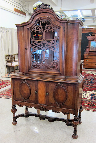 Appraisal: WALNUT CHINA CABINET ON CABINET English William Mary Revival design