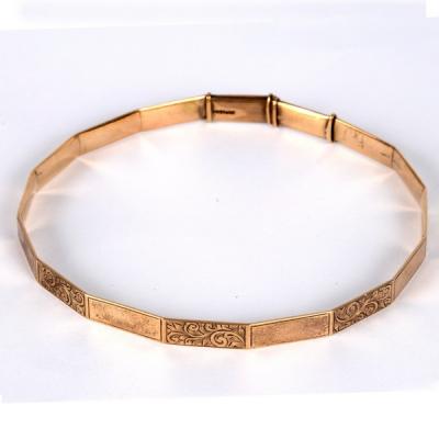 Appraisal: A ct gold arm bangle of polygonal shape with alternate