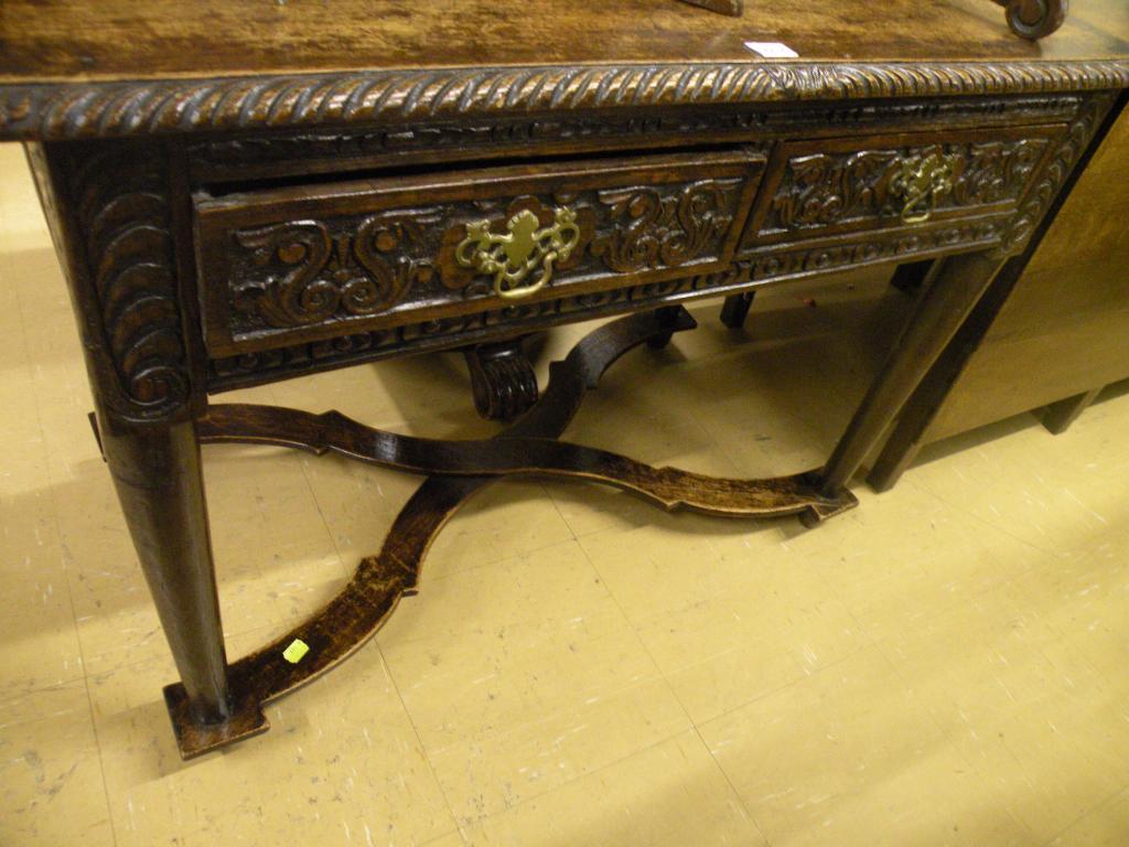 Appraisal: A Victorian oak side table with a carved border two