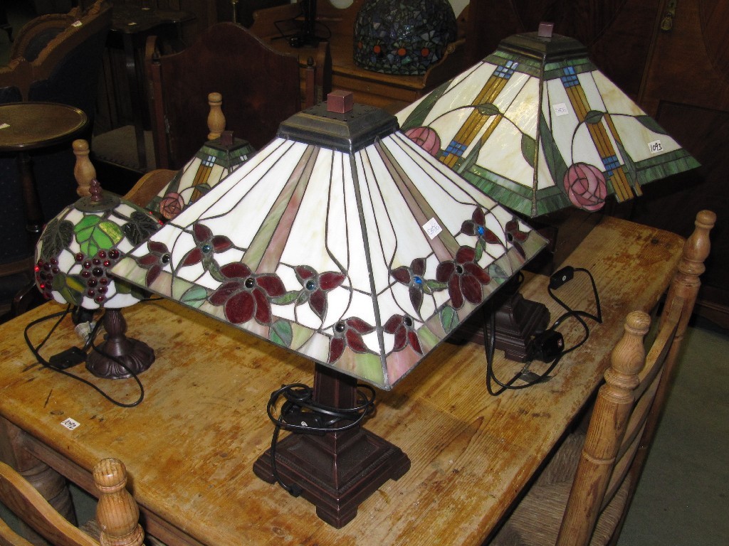 Appraisal: Four reproduction table lamps with leaded shades