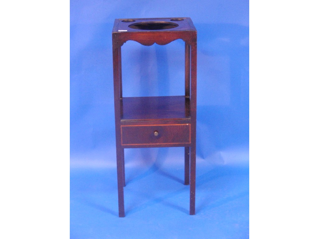 Appraisal: A George III mahogany washstand with recessed top and single