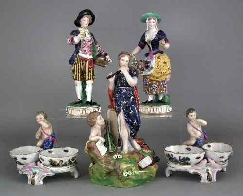 Appraisal: A pair of European porcelain models street vendors each ins