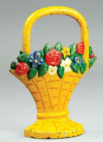 Appraisal: MIXED FLOWERS IN BASKET DOORSTOP Hubley cast iron yellow painted