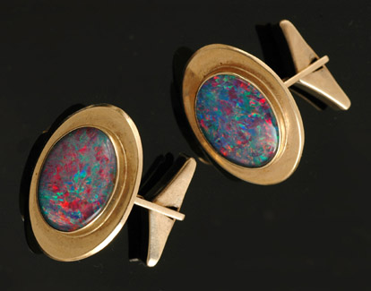 Appraisal: PAIR OF CT GOLD CUFFLINKS SET WITH OPAL DOUBLETS BY