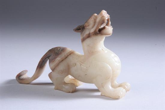 Appraisal: CHINESE WHITE AND CAF -AU-LAIT JADE FIGURE OF QILIN Eastern