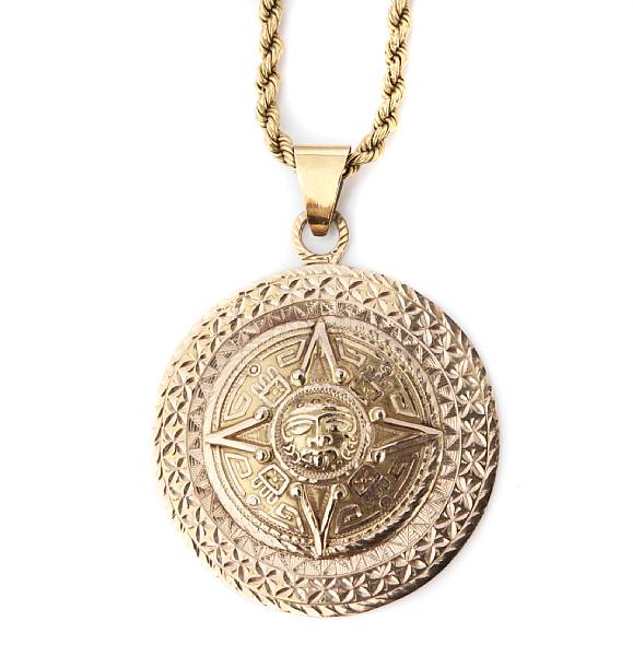 Appraisal: A gold Aztec medallion pendant with chain grs