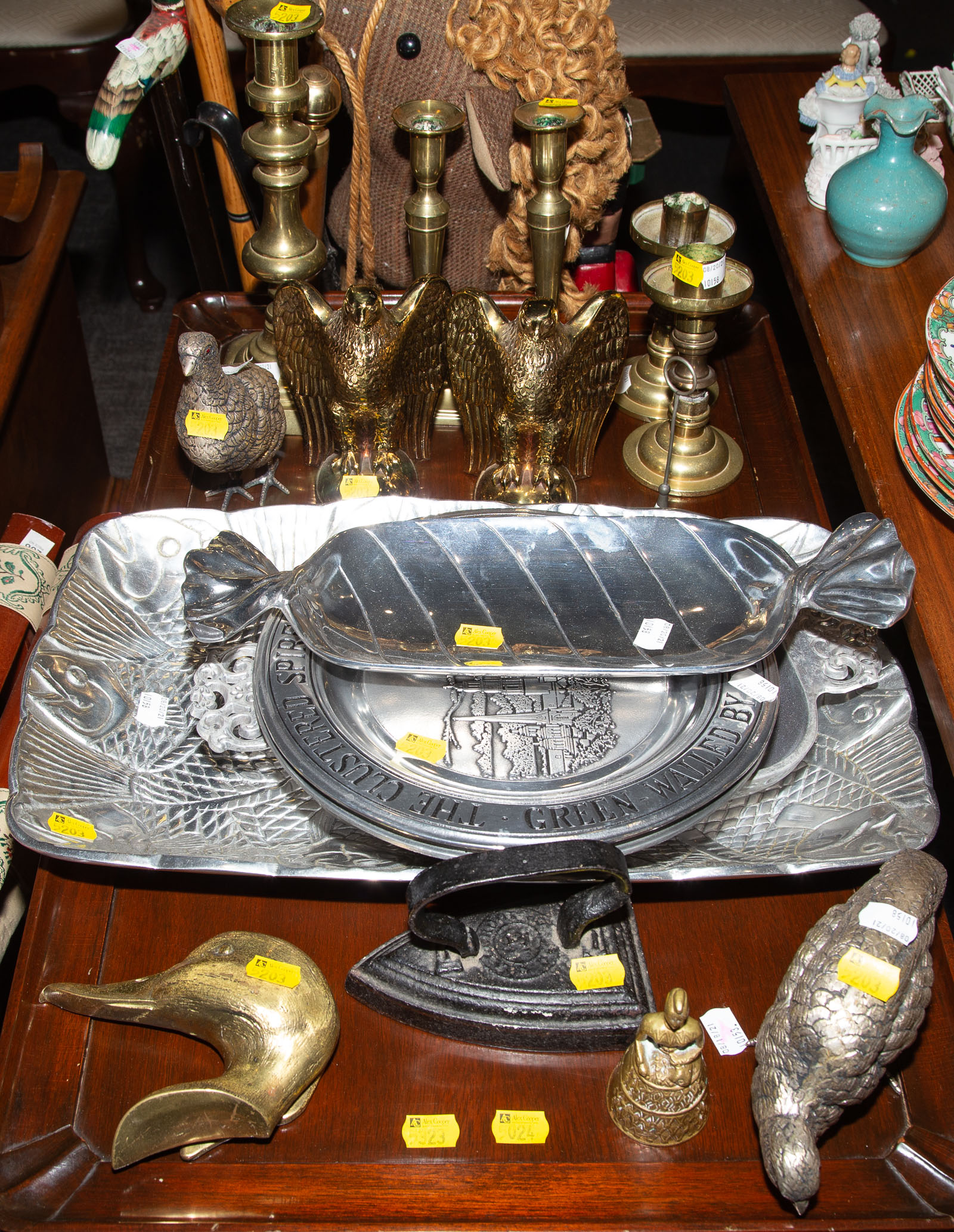 Appraisal: ASSORTED METAL ITEMS Includes brass candlesticks eagle bookends pewter plates