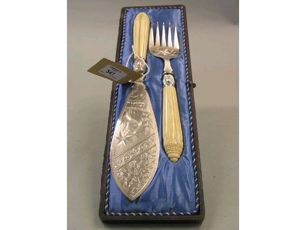 Appraisal: A pair of late Victorian silver plated fish servers elaborate