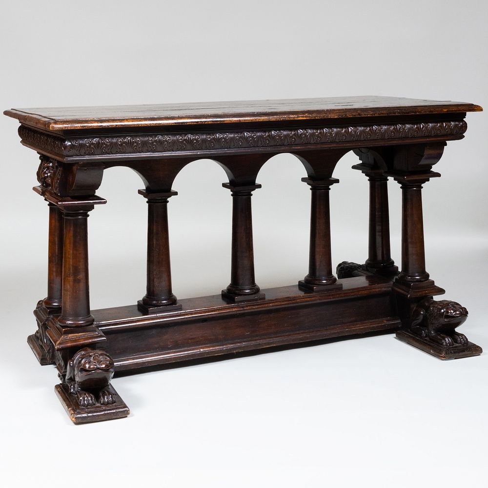 Appraisal: Italian Baroque Style Stained Walnut Trestle Table Fitted with one