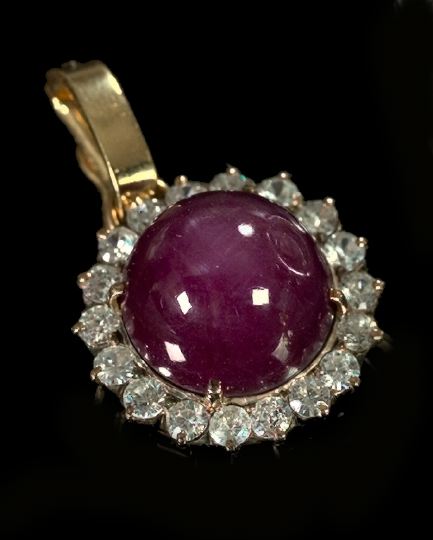 Appraisal: Fourteen-Karat Yellow Gold Cabochon Star Ruby and White Sapphire Enhancer