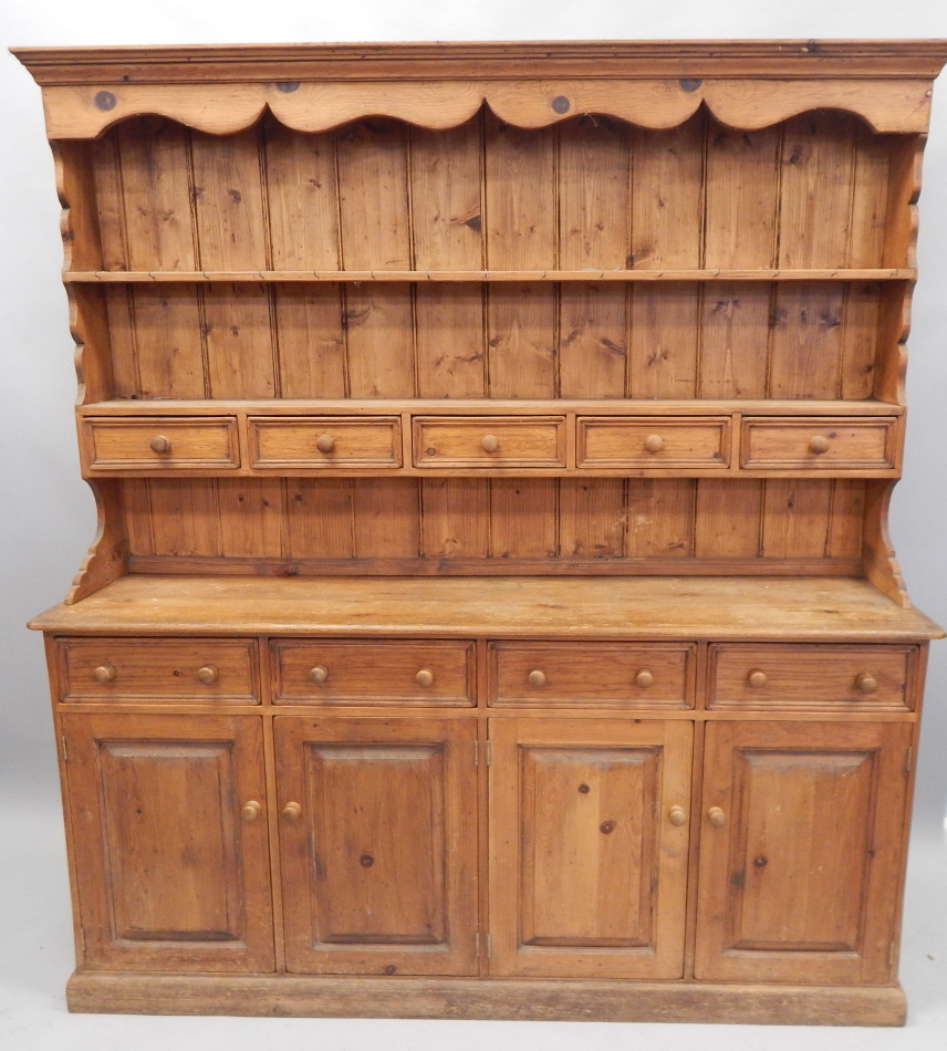 Appraisal: A modern pine dresser the raised back with two shelves