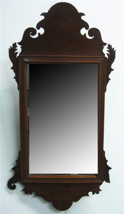 Appraisal: A fret carved mahogany looking glassIn the Chippendale style