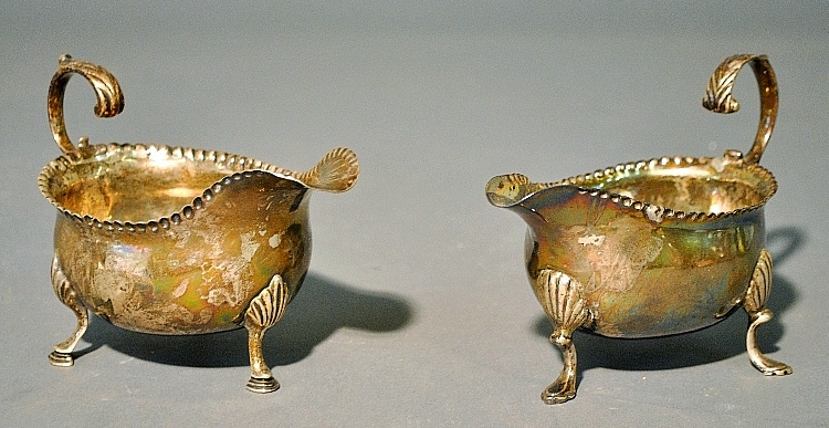 Appraisal: - Pair of George III silver creamers with punched rims