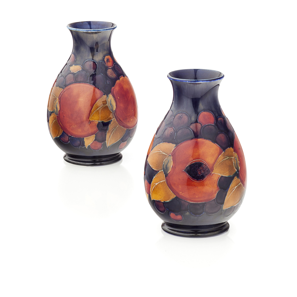 Appraisal: MOORCROFT POTTERY PAIR OF 'POMEGRANATE' PATTERN VASES of baluster form