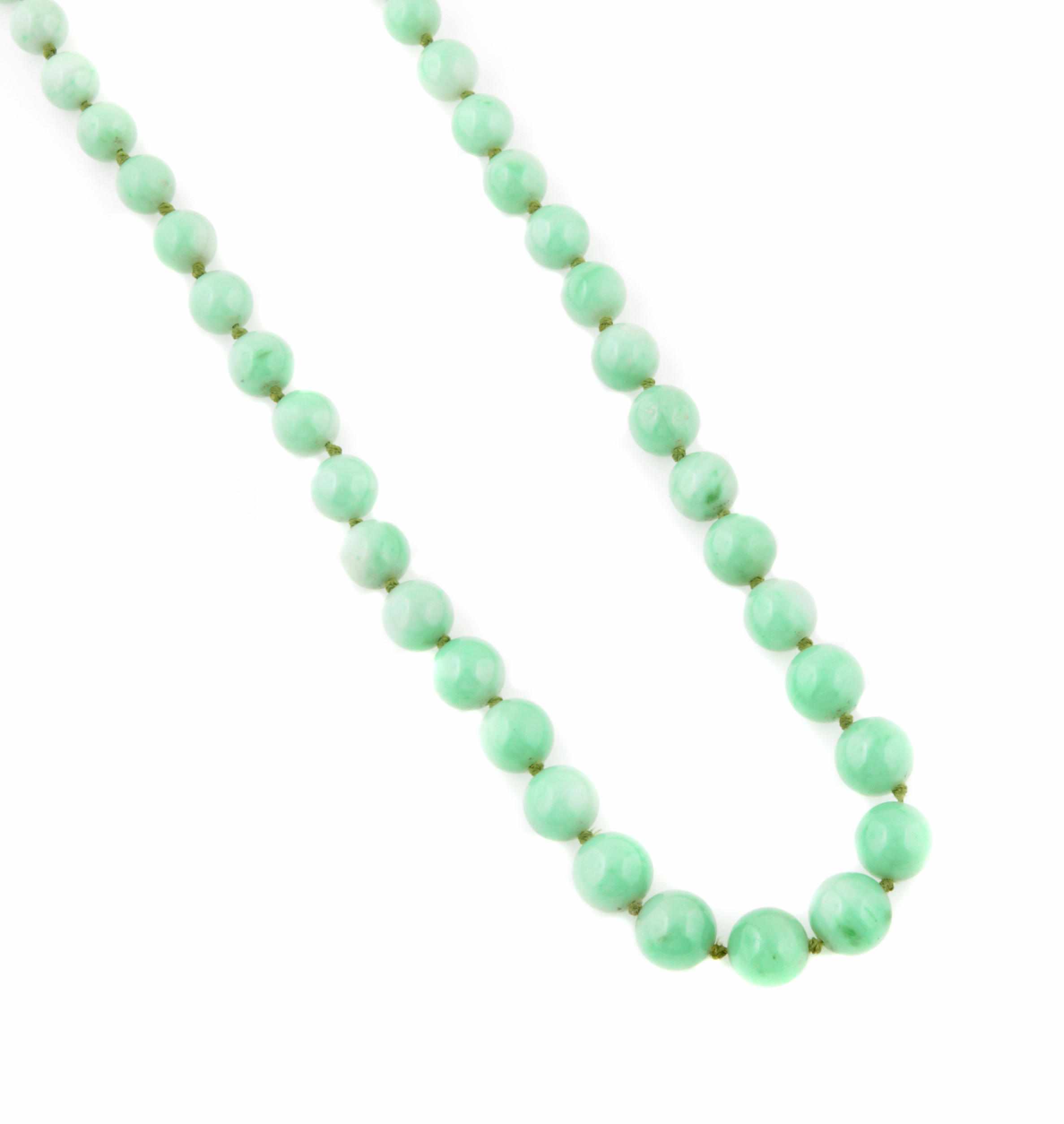 Appraisal: A jade bead necklace with k white gold clasp measures