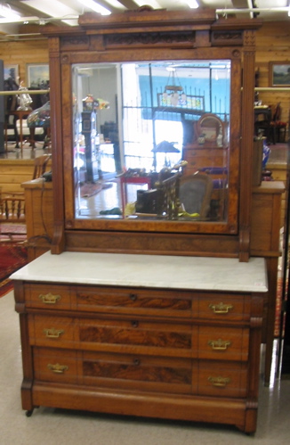 Appraisal: A VICTORIAN WALNUT DRESSER WITH ATTACHED MIRROR Eastlake influence American