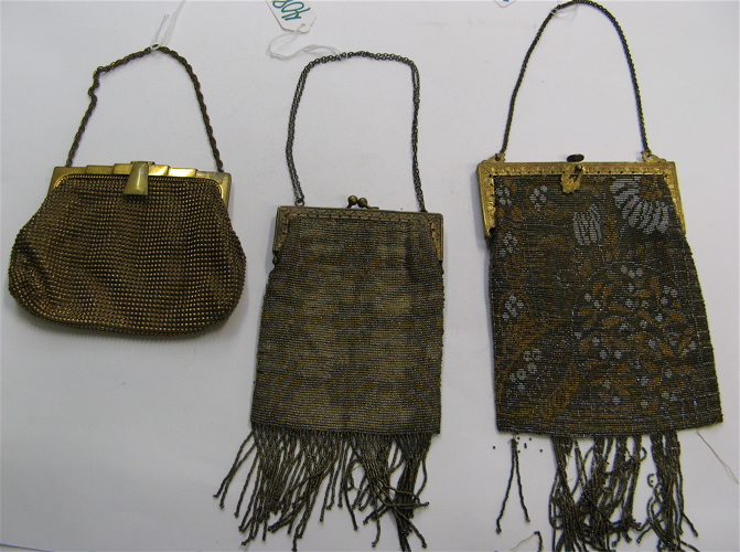 Appraisal: THREE LADY'S EVENING PURSES in metallic colors a French hand-made