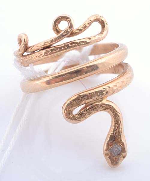 Appraisal: A SNAKE RING WITH A CLEAR STONE TESTED CT GOLD