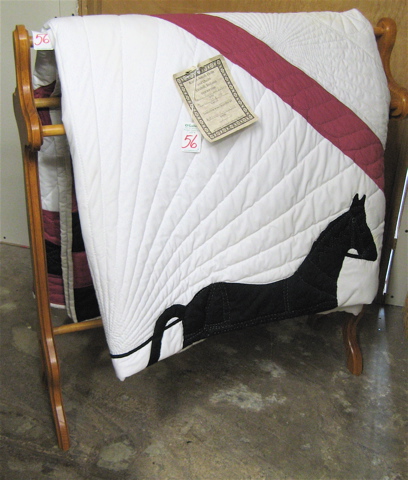 Appraisal: AMISH HANDMADE AND APPLIQUED QUILT and quilt rack The queen