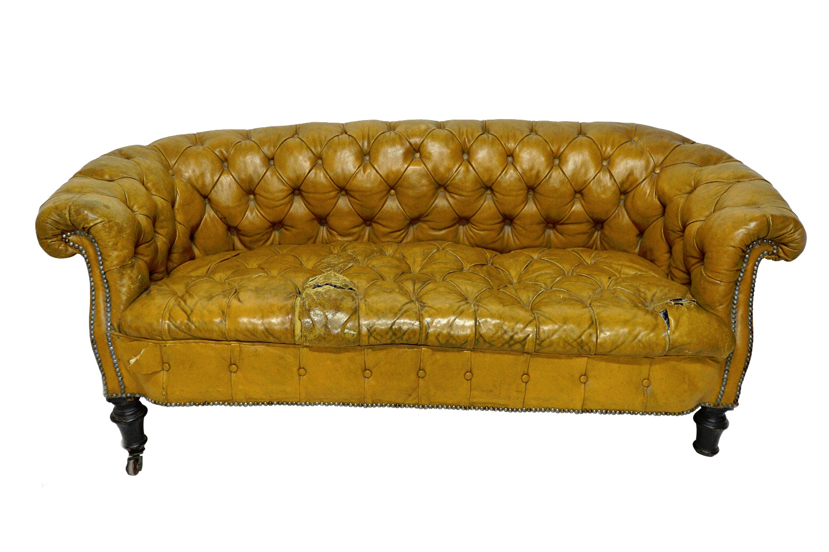 Appraisal: A small th century Chesterfield sofa with studded tan leather