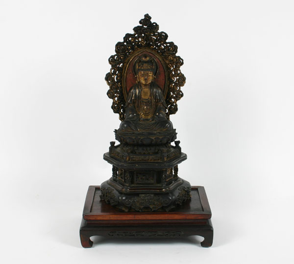 Appraisal: Asian religious figure intricately carved wooden Buddha carved stand traces